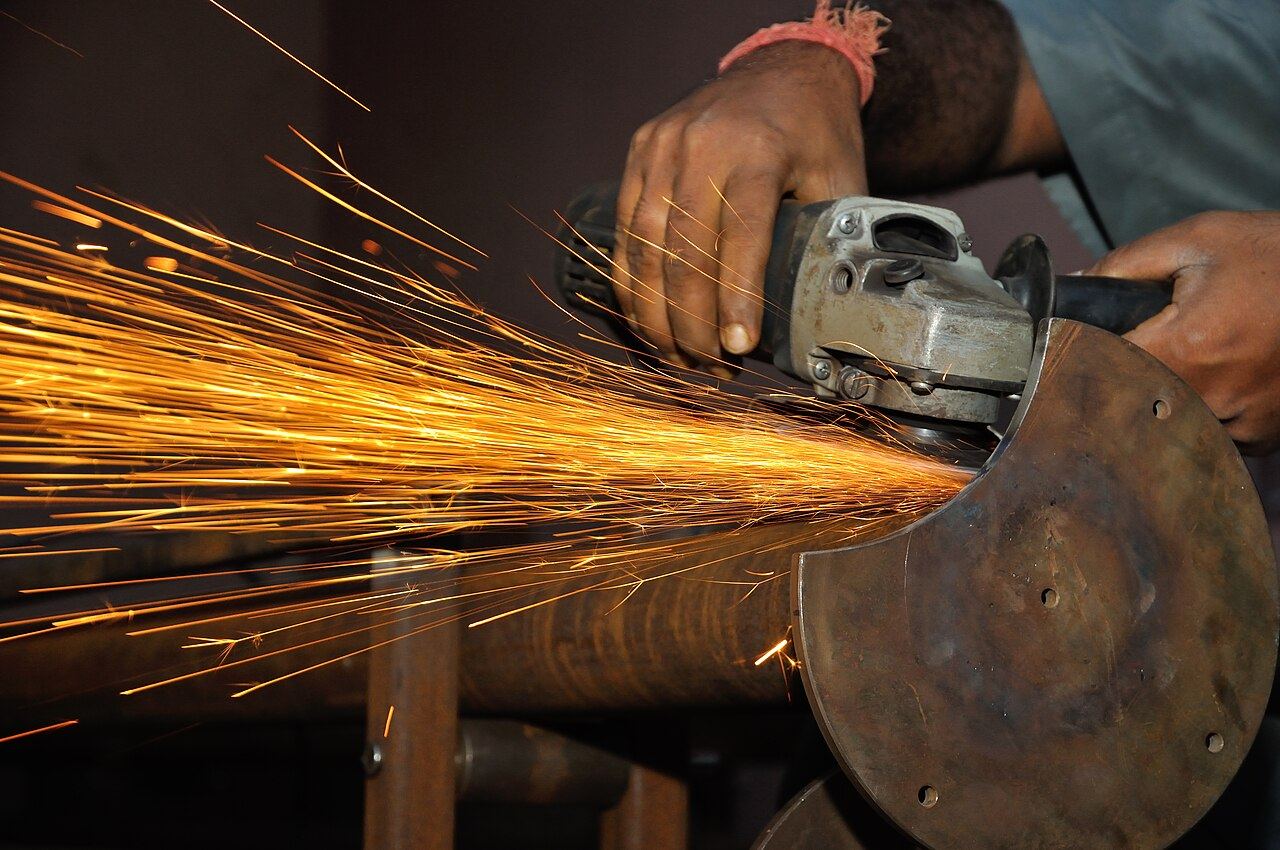 Sparks flying from an angle grinder cutting steel